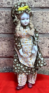 lot 103 image: 9 White Face Porcelain Doll WBraided Blonde Hair and Bendable Limbs