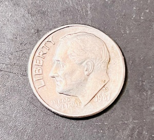 lot 144 image: 1987 D Error Dime - Struck Off Center or Tilted Collar