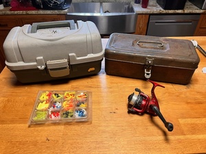 lot 189 image: Fishing Lot - Includes Shakespeare Reel, Bix of Jigs, Plano Tackle Box, &amp Vintage Metal Tackle Box