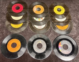 lot 268 image: Twelve (12) 1950s-60s 45 rpm Records in Sleeve - Including Marty Robbins (Devil Woman), Elvis Presley (Are You Lonesome Tonight), &amp Bobby Vee