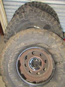 lot 36 image: BFG Goodrich tires with rims- tires not good rims are ready for some new rubber, rim size- 3312-50R15LT