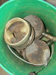 lot 49 image: green bucket full of pistons