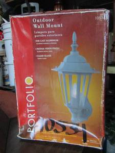 lot 62 image: Portfolio brand outdoor wall mount light, has lights- hammer- plyers-screw drivers and more