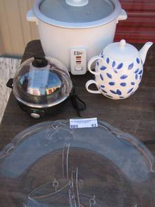 lot 63 image: Clear glass Christmas platter dash egg poacher, elite crock pot blue and white tea pot with cup