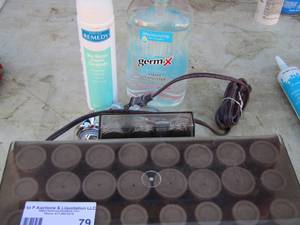 lot 79 image: Hair curlers- shower head- hand sanitizer and more