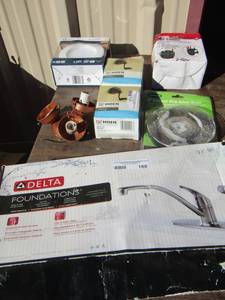 lot 168 image: delta kitchen faucet in original box, rob hooks, cup caddy and more