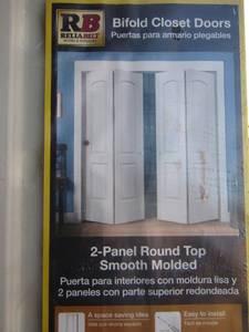 lot 21 image: 80 12 x 24in bifold closet doors new in package, merchandise has water damage