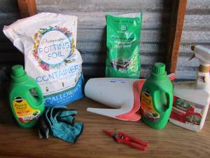 lot 178 image: garden lot includes plant food, potting soil, captain jacks dead bugs, 2 water pitchers