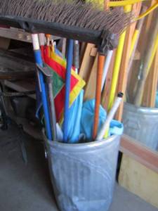lot 194 image: metal trash can full of garden tools, umbrellas misc. wood and more