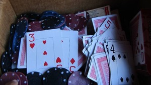 lot 198 image: Box of poker chips, decks of cards