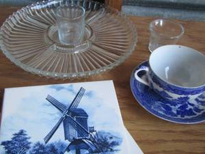 lot 206 image: Windmill design wall tiles, blue tea cup with plate