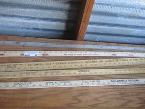 lot 227 image: 1 metal yard stick, 3 wooden yard sticks
