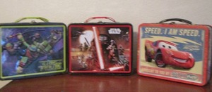 lot 31 image: Ninja turtle, star wars, cars- metal lunch boxes