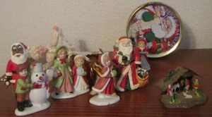 lot 33 image: Mini Christmas figurines, vintage Christmas candy tin