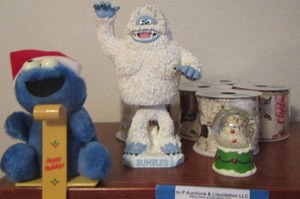 lot 37 image: Cookie monster, mini snow globe- 5 rolls of ribbon