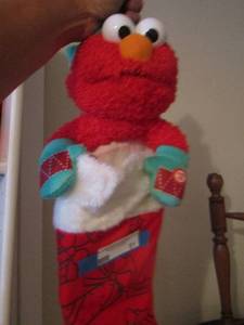 lot 51 image: Elmo singing Christmas son stocking
