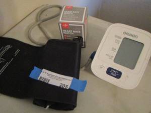 lot 205 image: Omron blood pressure cuff reader, heart rate watch