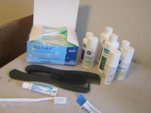 lot 206 image: Bathroom lot, combs , oral swabs for moisture, travel size shampoo and conditioner