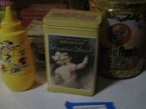 lot 383 image: Uncle Bens rice canister, Mickey Mouse mustard bottle and other tins