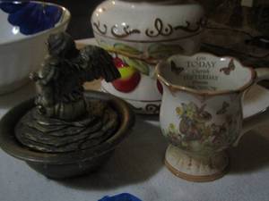 lot 406 image: Fruit design cookie jar,    angel with wings home dcor,    rabbit coffee cup