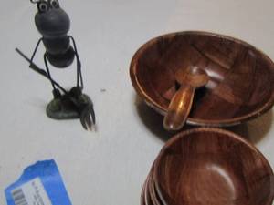 lot 431 image: metal ant holding  a fork,  wooden salad bowls