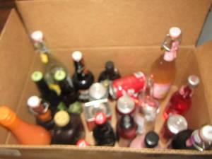lot 486 image: Box of vintage soda bottles and cans, beer cans for dcor only