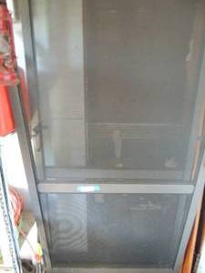lot 670 image: 2  screen doors 36 x 80  fairly new looking