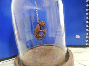 lot 578 image: VINTAGE Carved peach pit - MONKEY  in glass dome
