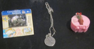 lot 858 image: NEW AIRPLANE KEY CHAIN, RAIN BONNET, GRANDMOTHER NECKLACE