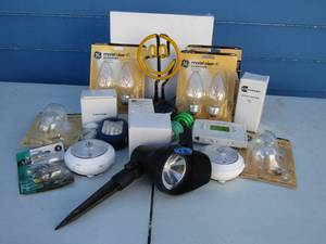 lot 18 image: Assorted lights and lightbulbs, including neon smile-face light