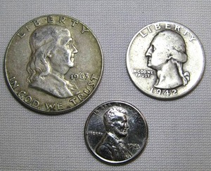 lot 31 image: 1943 Steel Penny, 1942 Washington Quarter (90% silver), and 1963 Franklin Half-Dollar (90% silver)