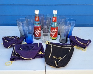 lot 22 image: Coca Cola glasses, Dr Pepper collectible bottles, Jim Beam whiskey glass and Crown Royal felt bags