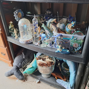 lot 63 image: Assorted dolphin memorabilia, including dolphin figurines, dolphin-themed Galileo thermometer, and more