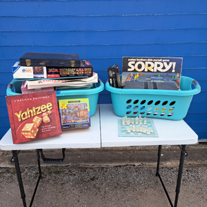 lot 75 image: Assorted board games, including Dallas-Opoly, Sorry, chess, Yahtzee, and more
