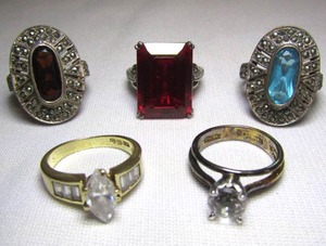 lot 87 image: Four sterling silver rings and One 10k gold ring