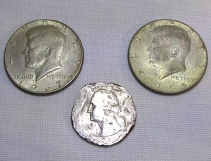 lot 99 image: 1965 and 1967 Kennedy half dollars and damaged 1994 Washington quarter