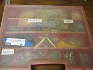 lot 91 image: Red case bolts- screws- hinges