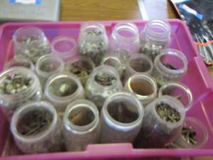 lot 108 image: Purple tote of misc. screws- nuts- bolts- washers plus