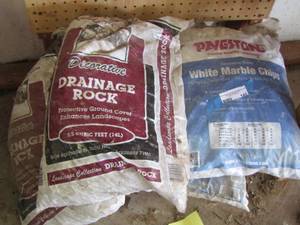 lot 145 image: Drainage rocks- marble chips- qty 5 bags total for all