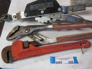 lot 226 image: Heavy duty pipe wrench, plyers, and a come-a-long