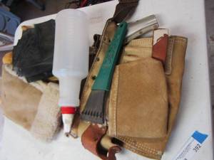 lot 392 image: Tool bag with scrapper spray bottle