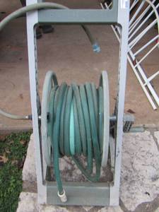 lot 544 image: Water hose with outdoor roller