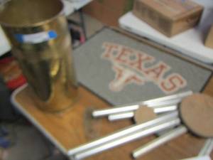 lot 555 image: Wind chimes- Texas longhorn small entry rug- Gold metal umbrella holder