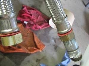 lot 569 image: Stainless steele water heater connectors- washer water connector