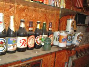 lot 582 image: Beer bottles cans used for dcor