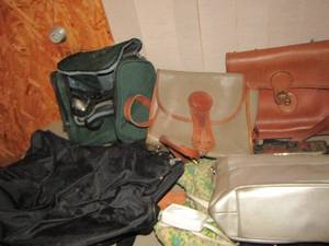 lot 591 image: Grey tote of bags- purses- heating pad