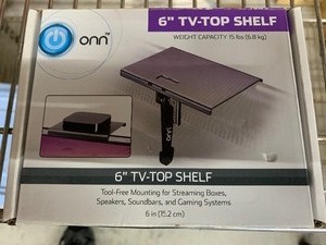 lot 187 image: Onn tv Top shelf