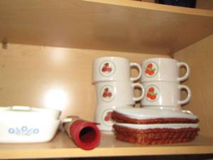 lot 743 image: Corning dishes- 2 have wicker holders- set of stackable mugs qty 2 sets