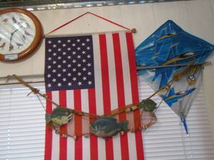 lot 778 image: bird clock - hanger flag - blue angel kite - fish net