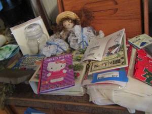lot 817 image: plant book - table cover - glue sticks - candle - hello kitty book and more